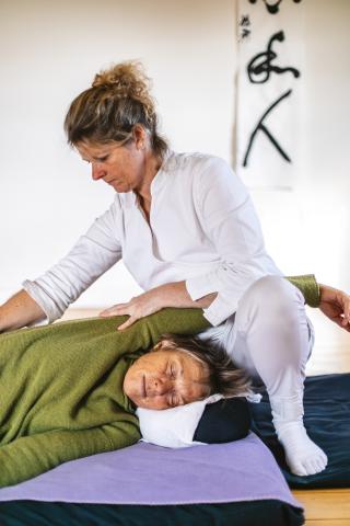 Kate giving  Shiatsu with receiver in side position