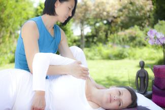 Shiatsu with receiver laying on side