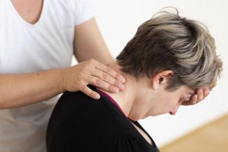 photo headshot, person receiving shiatsu back of neck