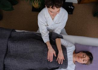 Helen Bradbury treating a Biodynamic Craniosacral Therapy client