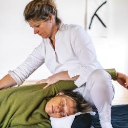 Kate giving  Shiatsu with receiver in side position